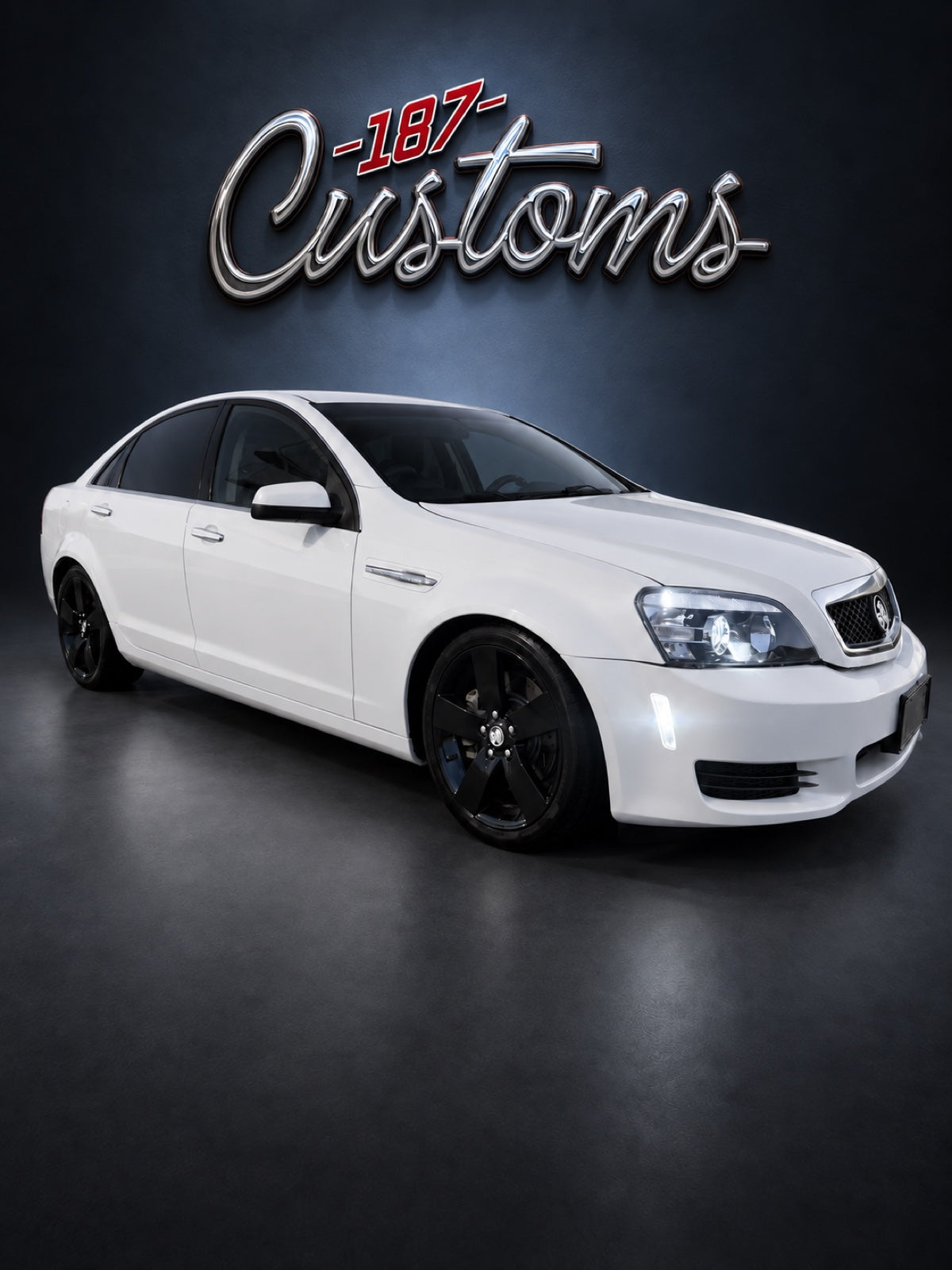 Caprice front view with 187 Customs wall art